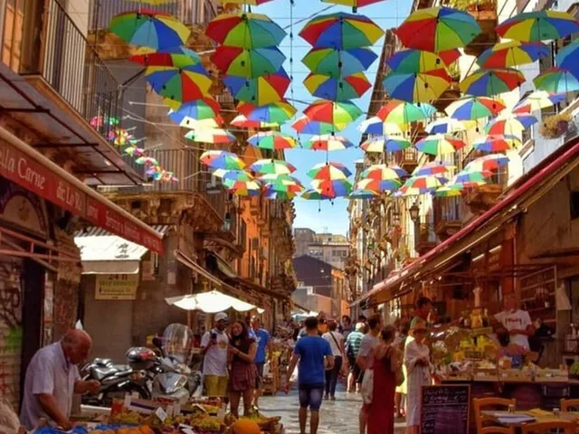 A busy street market with many colorful umbrellas suspended overhead.